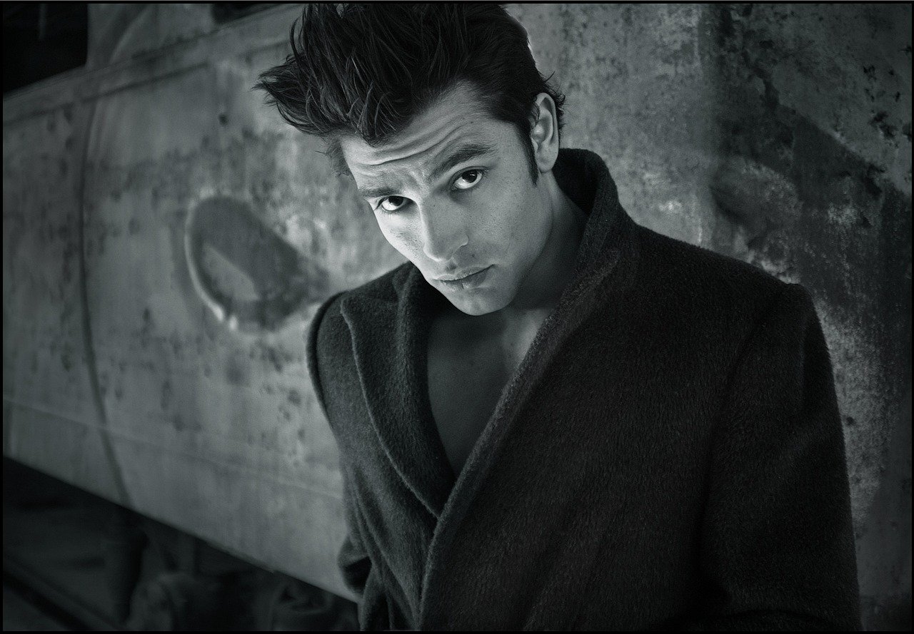 Elegant woman selecting high-end shoes in a stylish boutique.